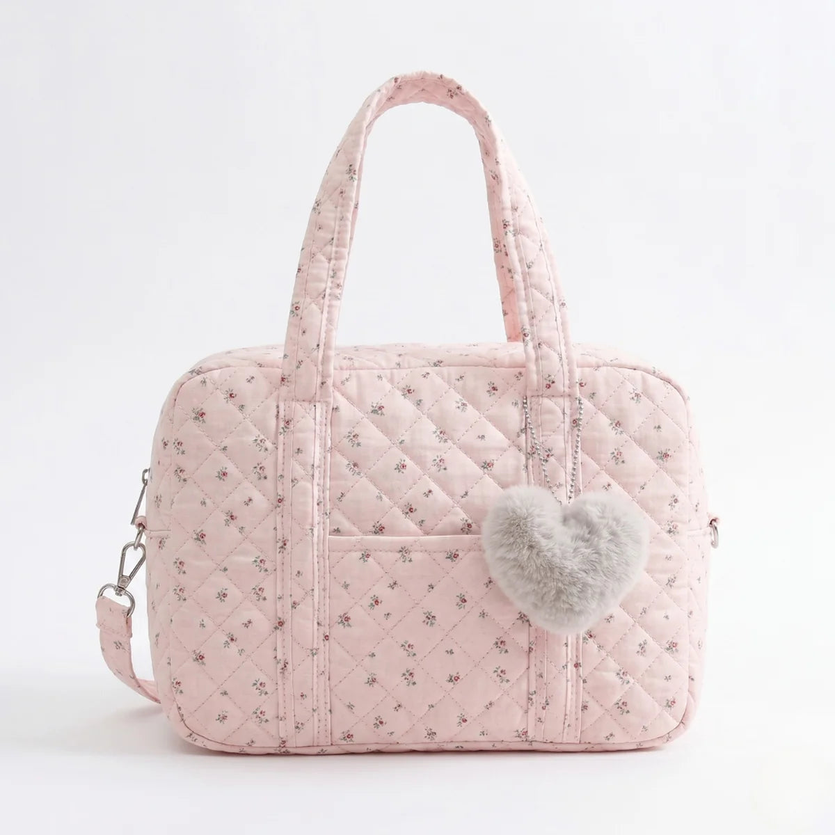 vue de face du Sac à langer gaz de coton Matelassé rose avec pompom en forme de Cœur