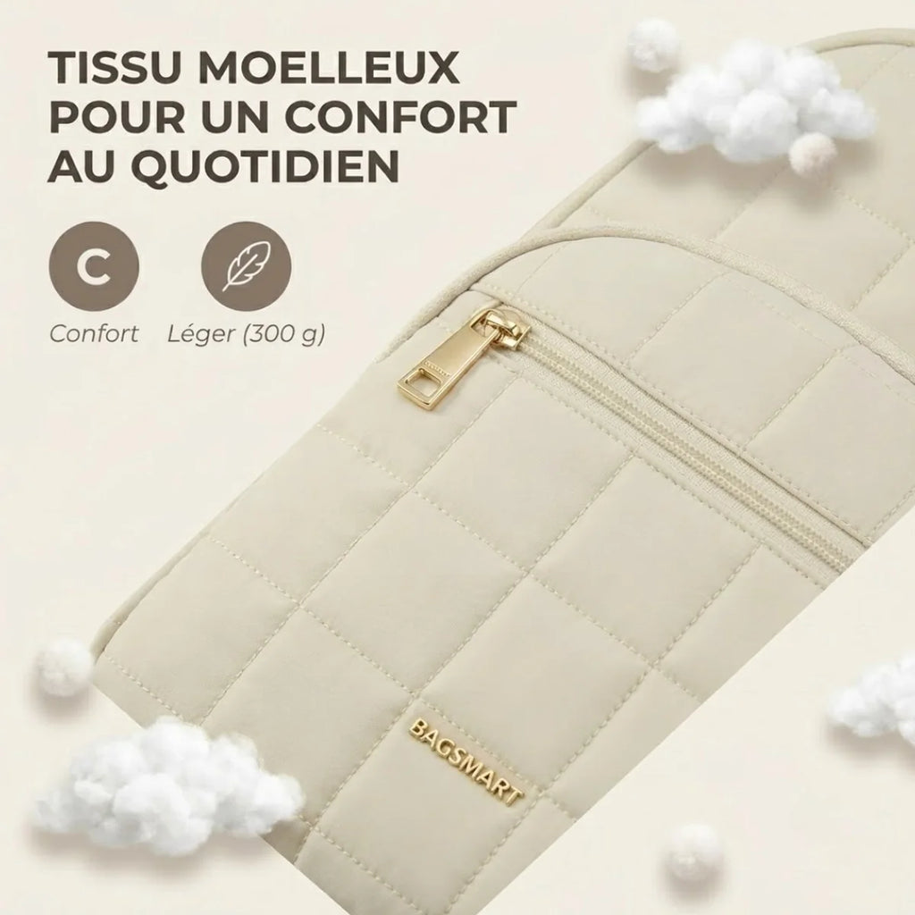 Vue du sac à dos à langer matelassé en gros plan sur le tissu près du zip, infographie "Tissu moelleux pour un confort au quotidien" avec badges Confort et Léger (300 g), nuages décoratifs.