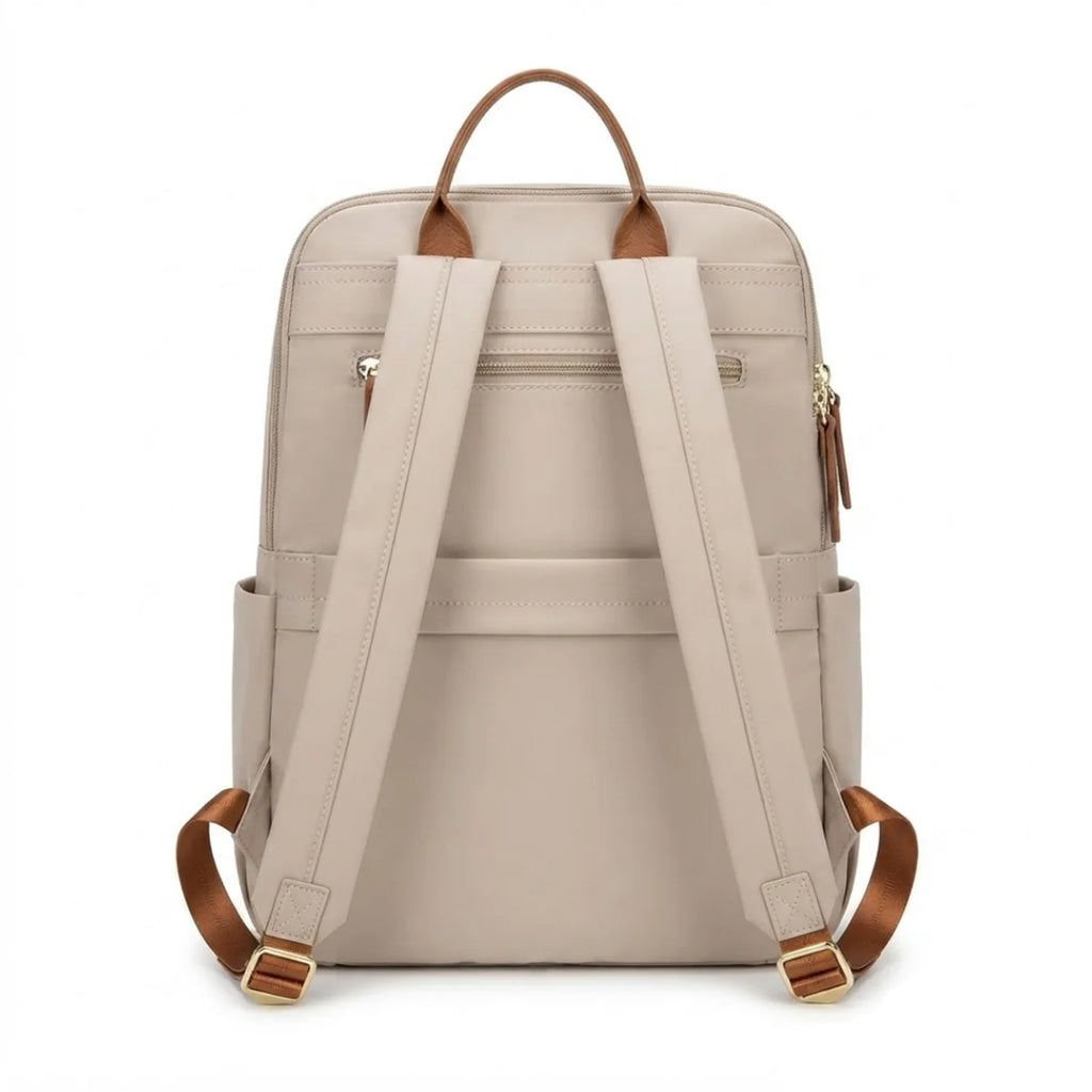 Vue du Sac à Langer Tissu Compact de dos, montrant les sangles réglables, la poignée en cuir et la poche zippée arrière.